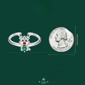 S925 silver reindeer ring with heart gem and size comparison against a quarter coin