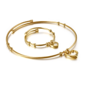 Golden heart jewelry set with woven steel wire choker and matching bangle on white background