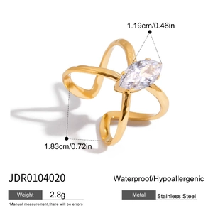 Macro detail of gold stainless steel crossover ring with marquise zircon and size dimensions