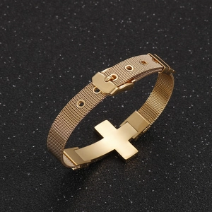 Detail of golden stainless steel mesh bracelet with cross charm and watch-band buckle