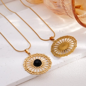 Gold plated stainless steel necklace with sun flower pendant and black center stone