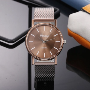 Close-up of Geneva quartz watch with brown sunray dial and gunmetal mesh strap details
