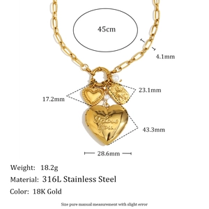 Detail of 18K gold-plated stainless steel chunky chain necklace with heart locket and charms