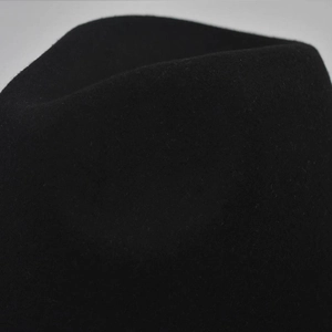 Detailed close-up showing the soft wool felt texture of this elegant black fedora hat
