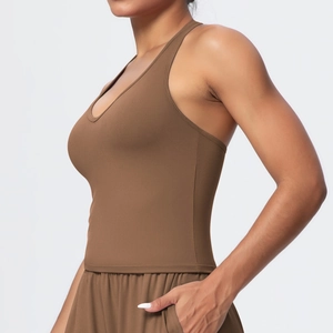 Close-up of side view on dark brown racerback sports bra with matte elastic fabric