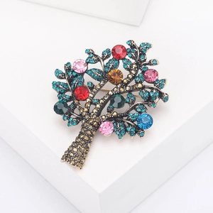 Elegant Tree of Life brooch with colorful crystals and blue rhinestones on metal base