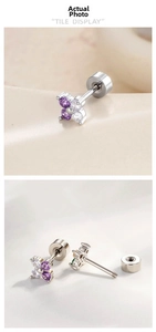 Detail of flower stud earrings with purple zircons and flat screw back design