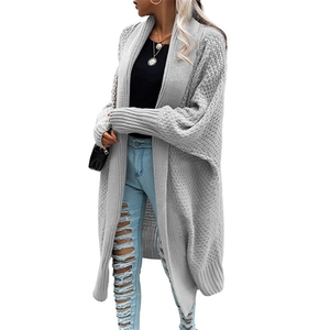 Detailed view of grey long-line knitted cardigan with batwing sleeves and chunky texture