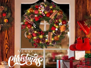 Close-up of a Christmas wreath with pine cones, candy canes, and warm LED fairy lights