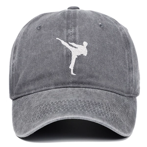 Detail of the white martial arts embroidery on gray washed cotton baseball cap