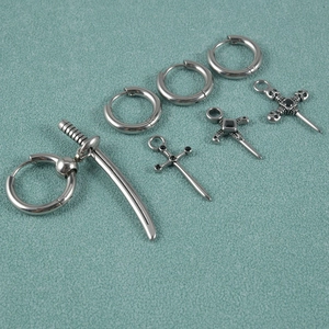 Punk style stainless steel stud earrings with sword pendant and black rhinestone accents