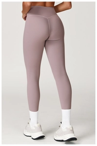 Rear view of high-waist yoga pants in dark purple with V-shaped stitching for butt lifting