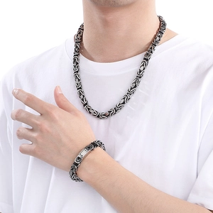 Men's punk hip-hop silver Byzantine steel chain necklace and bracelet set on model