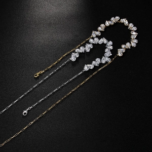 Three-layer heart necklace with pear-cut rhinestones in gold and silver finish