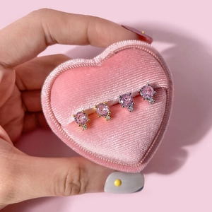 Elegant gold and silver stud earrings with pink round zircon in a heart velvet box