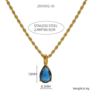 Detail of 18K gold plated stainless steel rope chain with blue teardrop pendant