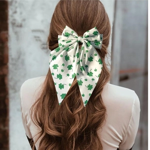 Elegant white bow hair clip with green clover print for women's spring hairstyle