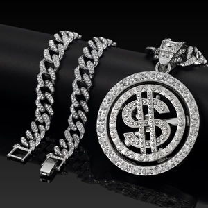 Hip hop style silver Cuban chain necklace and bracelet set with rotating dollar sign pendant