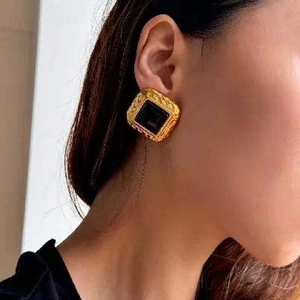 Square hammered 18k gold plated stainless steel earrings with black center on model