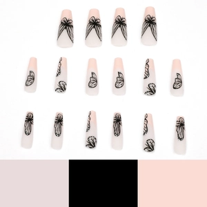 Long coffin shape false nails with nude pink base and black butterfly wing design