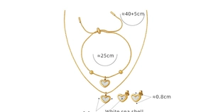 Detail view of heart shell jewelry set including necklace, bracelet and stud earrings