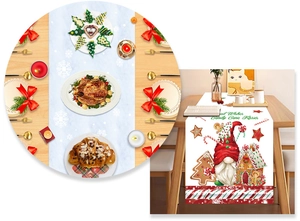 Detail of Christmas table runner featuring gnomes and gingerbread house patterns