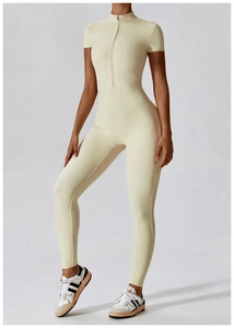 Detail of the high-elasticity fabric and half-zip collar on this beige yoga bodysuit