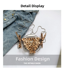 Detailed view of leopard print mini bag with metal butterfly and ruffle trim details
