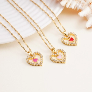 Three elegant heart necklaces in pink and red enamel with white cubic zirconia setting