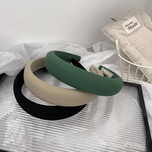 Three padded sponge headbands in dark green, khaki, and black fabric textures