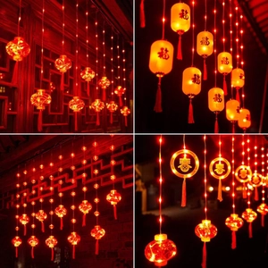 Detail of red LED lanterns with Fu and Chun characters for Chinese New Year decor