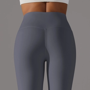 Macro shot of V-shaped back waistband on high-waist grey yoga pants with butt-lifting effect
