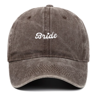 Macro view of white 3D Bride embroidery on dark brown washed cotton baseball cap
