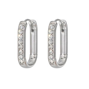 Detail of silver U-shaped hoop earrings with sparkling cubic zirconia on white background