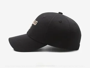 Close-up of black knit baseball cap with 3D LG embroidery and breathable eyelets