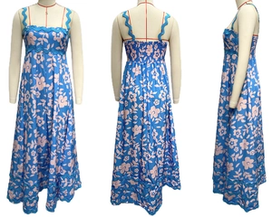 Floral summer dress with thin straps, elastic back, and blue wavy decorative borders