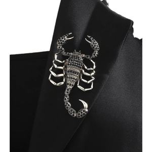 Elegant silver scorpion brooch with black rhinestones on a black suit lapel pin