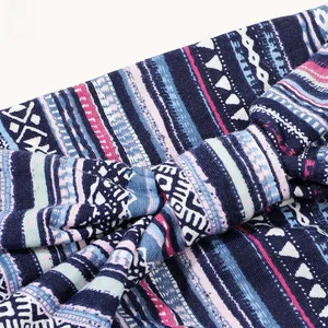 Macro detail of bohemian geometric pattern on a flexible knitted leopard-style headband