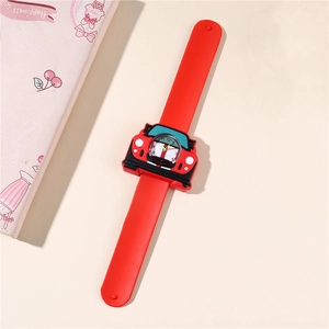 Close-up of red car-shaped slap watch with silicone strap and analog numeric dial