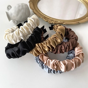 Elegant ruched satin headbands in multiple colors for a stylish minimalist hair look