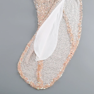 Close-up of champagne pink sequin evening gown showing mesh texture and satin lining