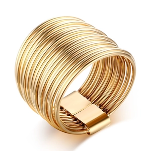 Polished gold multi-layer wide stainless steel open ring for women on white background