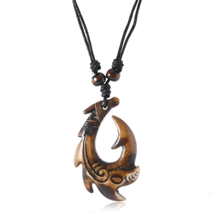 Tribal Māori Hei Matau fish hook necklace in carved brown resin with adjustable rope cord
