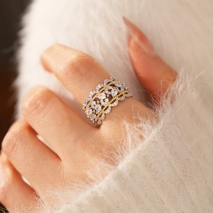 Detailed macro of vintage镂空lace ring with zircon gemstones and gold-beaded texture