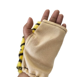 Cute animal ear headband with yellow and black tiger stripes on a soft beige fabric base