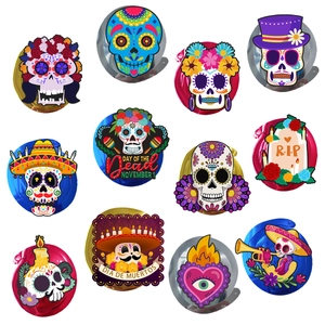 Colorful Day of the Dead spiral hanging decorations with skull and tombstone cards