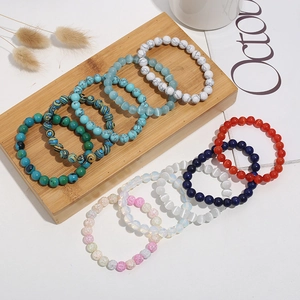 Variety of 8mm cat-eye and natural stone bracelets in colorful gradient beaded styles