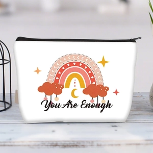 Detail of white canvas makeup bag with 'You Are Enough' quote and rainbow print