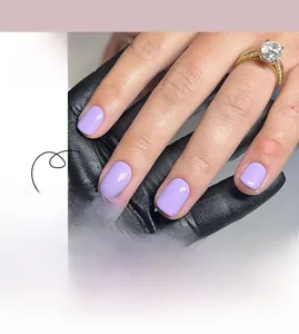 Detail view of glossy lilac short square press-on nails with product layout and hand model