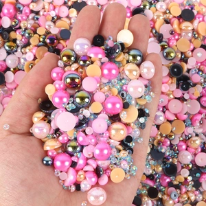 Close-up of mixed colorful half-round resin pearls and rhinestones for DIY nail art